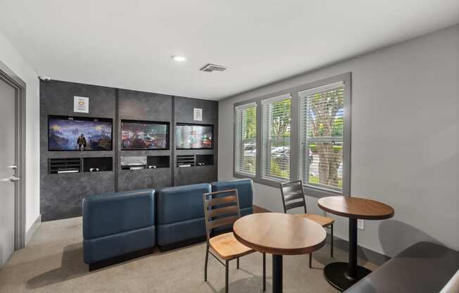 a living room with couches tables and chairs and a television