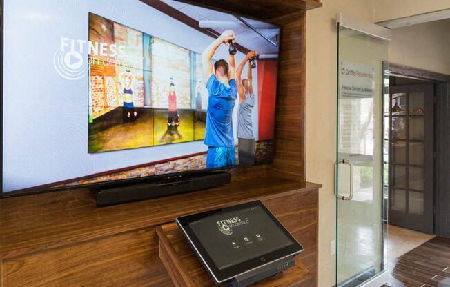 a display case with several televisions on the wall