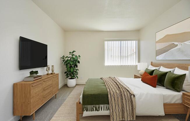 a bedroom with a large bed in a hotel room