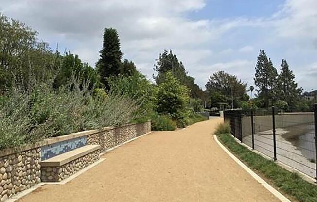 Outdoor walkway with a stone bench