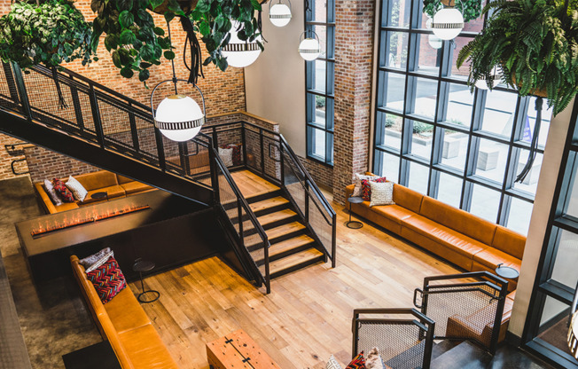 Stunning two-story lobby and seating area with green space