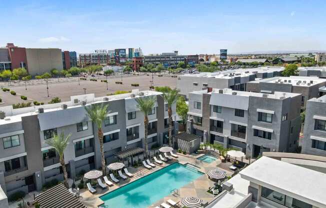 an aerial view of an apartment complex with a swimming pool