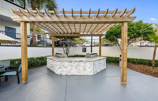 a patio with a seating area and a pergola