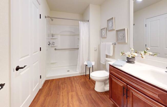a bathroom with a sink toilet and a shower