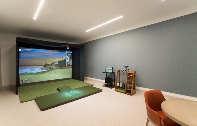 Practice your swing year-round in the on-site golf simulator at Modera Liberty Row, offering a convenient way to play and refine your game close to home.
