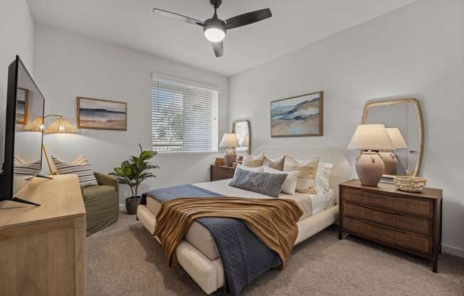 a bedroom with a bed and a ceiling fanat Westbury Apartments, Rancho Cucamonga, 91739