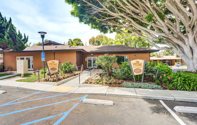 A building with a sign that says "Village" in front of it.