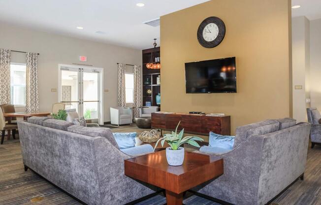 a living room filled with furniture and a large window