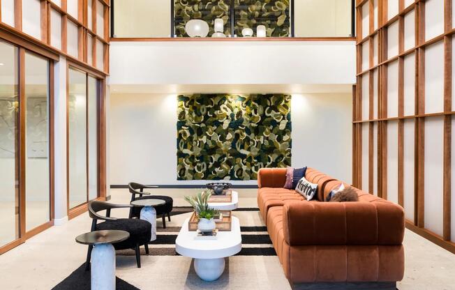 Experience elegance and comfort at Modera Raleigh Hills! Our hotel-inspired lobby is designed for relaxation and connection, making it the ideal spot to start your day or wind down in style.