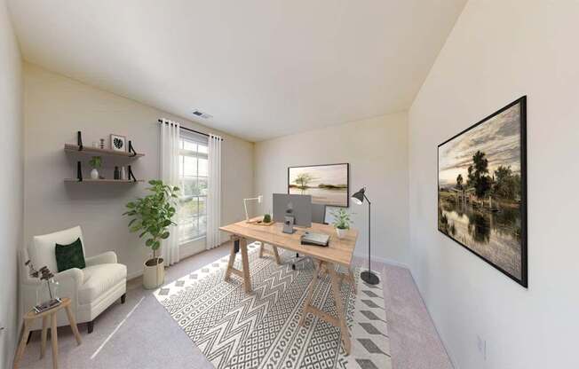 A room with a desk, chair, and a painting on the wall.