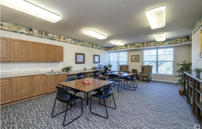 A room with a table and chairs in it.