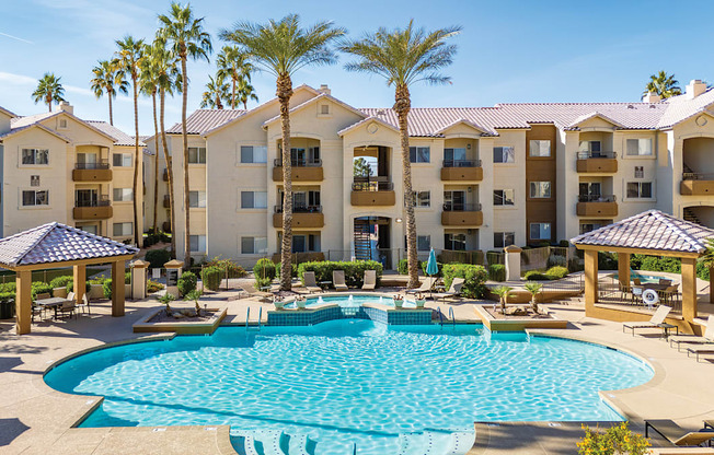 Resort-style swimming pool with ample lounge chairs available - Sonterra Apartments at Paradise Valley