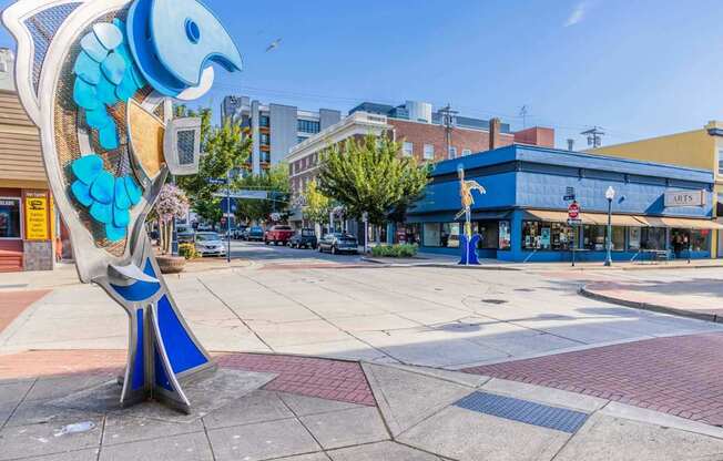 A blue and white bird statue is in the middle of a plaza at Spyglass Hill Apartments, Bremerton, 98337