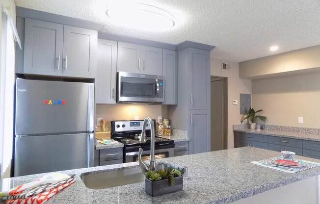 Apartments in Sacramento-The Palms-Kitchen with Stainless Steel Appliances, Overhead, and Recessed Lighting