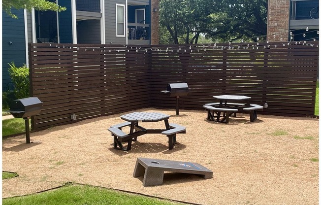 a patio with a picnic table and barbecue grill at Sunset Canyon, San Antonio, TX