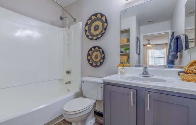 a bathroom with a sink toilet and a bath tub