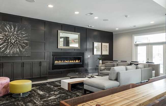 a living room with a couch and a table and a fireplace