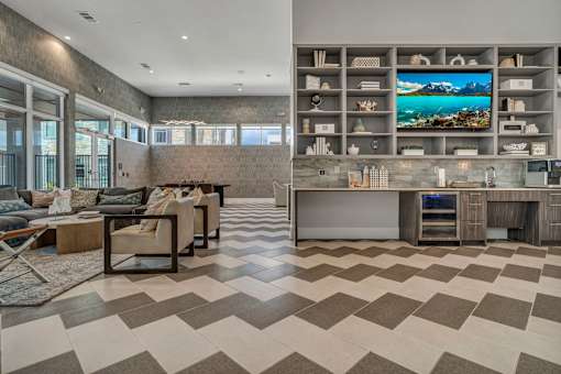 A modern living room with a large TV and a checkered floor.