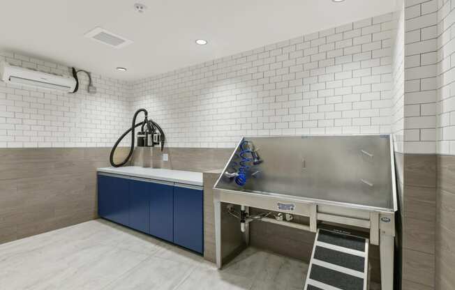 a kitchen with a stainless steel counter top and a sink  at Link Apartments® H Street, Washington