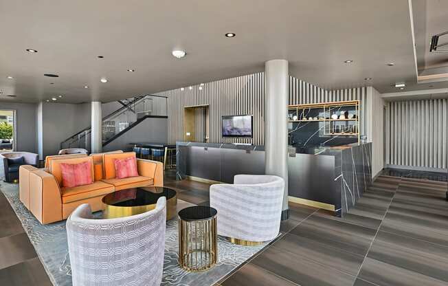 A modern living room with a grey and white color scheme.