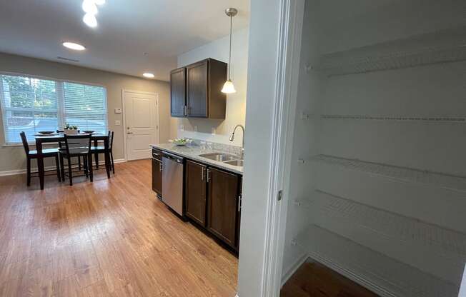 Kitchen with pantry closet at Oasis at Cedar Branch in Wilmington, NC