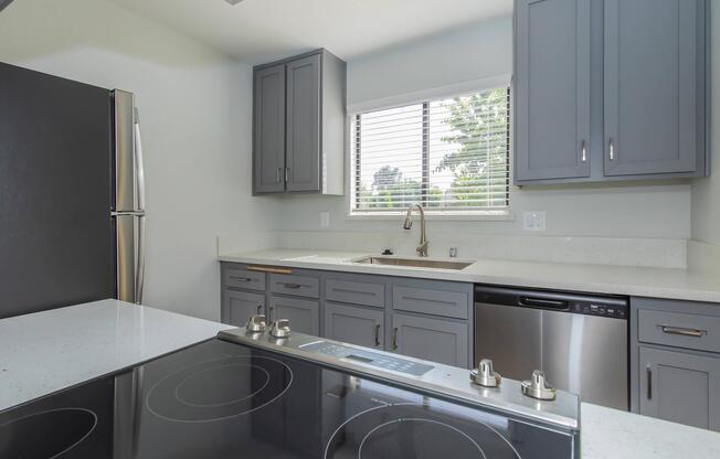 a kitchen with a sink and a window