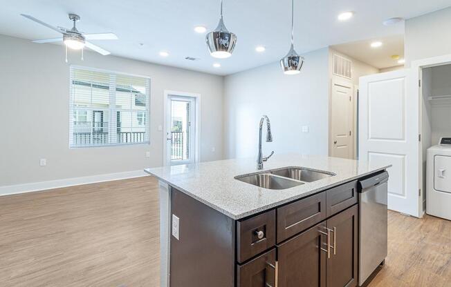 a kitchen with a sink and a counter top at The Fitzroy San Marcos, Texas