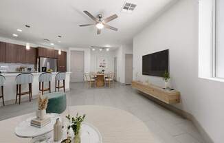 A modern living room with a dining area and a kitchen in the background.