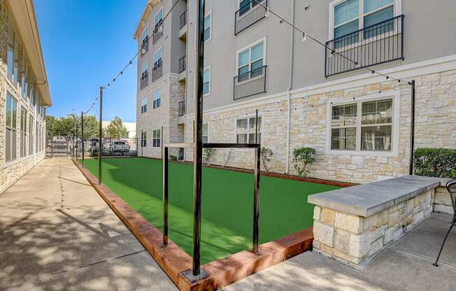 our apartments have a spacious courtyard with a green lawn and a basketball court