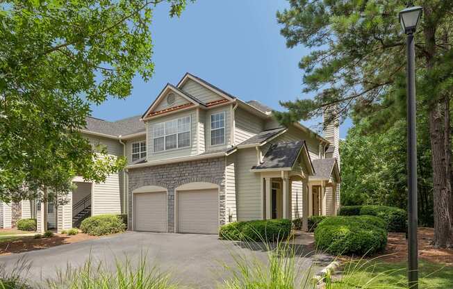 A house with a grey roof and a grey garage door.