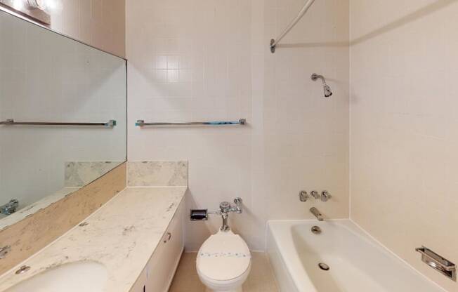 a bathroom with a sink toilet and bathtub