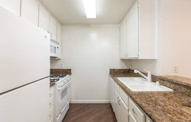 Kitchen with White Appliances and White Cabinets