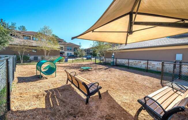 our apartments showcase a dog park with a playground