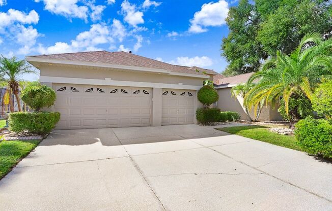 Beautiful 4/3 Split Floor Plan Home with Pool, 3-Car Garage & New Flooring!