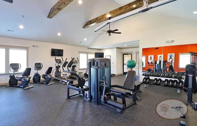 A fitness center with weight training and cardio equipment.