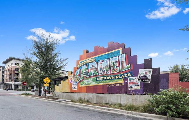 a mural on the side of a building on a city street