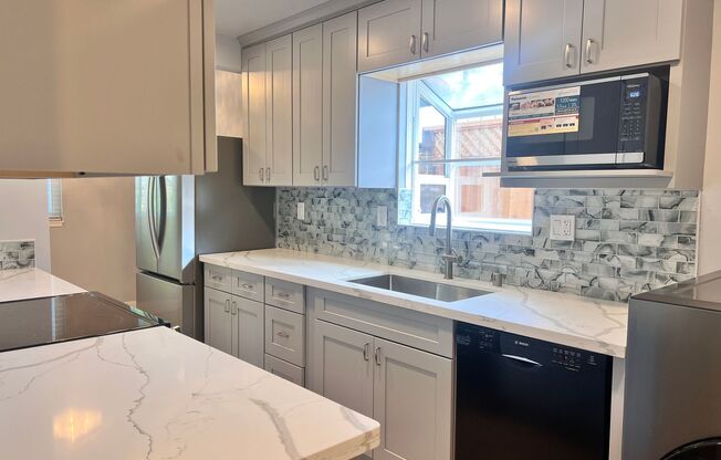 Completely Remodeled 4 Bedroom Home with Central AC and Fans in Every Room!