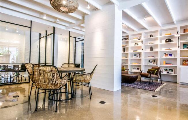 A room with a table and chairs in it.