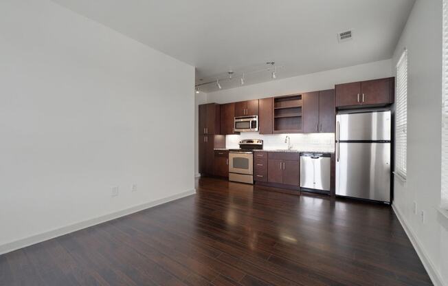 12 South Apartments - Nashville TN - kitchen with dark wood cabinets and stainless steel appliances