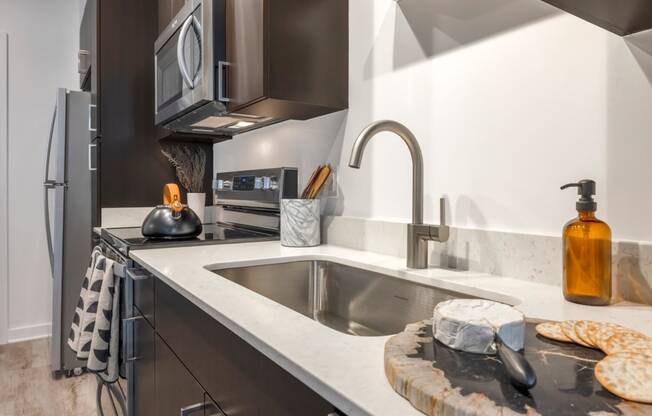 Model kitchen with undermount sink and a microwave