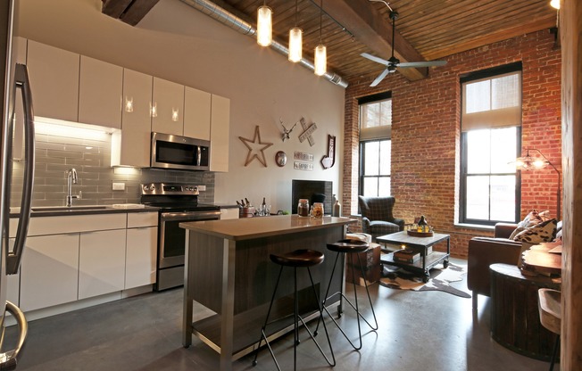 Polished Concrete Floors Throughout and Original Brick and Wood Beams Accent Apartments