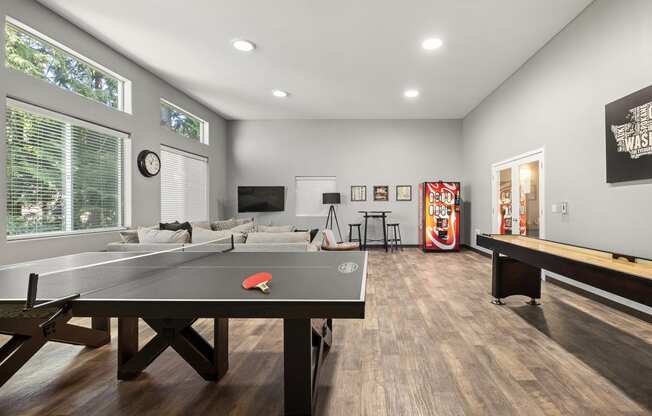 a games room with a ping pong table and a foosball table at Mill Pond Apartments, Washington