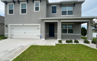 Amazing 5 bedroom 3 bath newly built home near Lake Nona with water views and room for everyone!