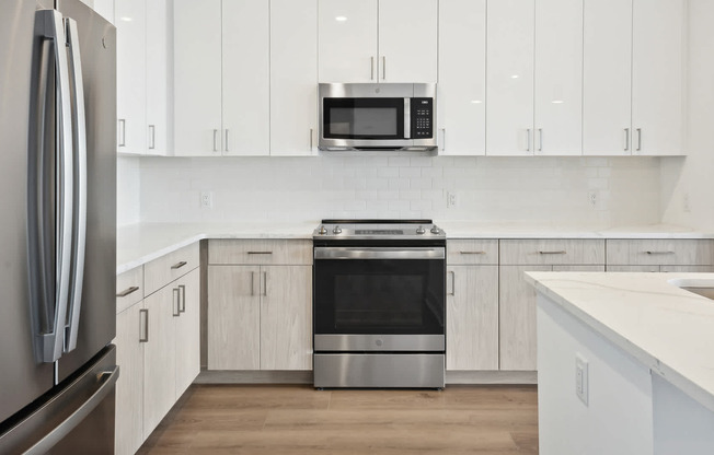 Kitchen with Stainless Steel Appliances and White Granite Countertops