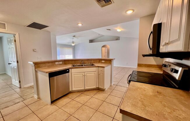 Charming 3BR Home with 2-Car Garage & Lawn Care Included in Lehigh Acres!