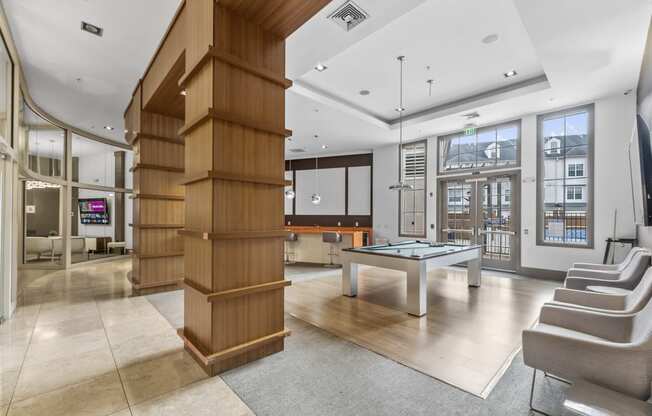 a game room with a ping pong table and a bar at Harbor Pointe, New Jersey
