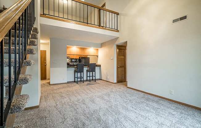 Open concept loft floorplan with view off living room and loft at Fountain Glen Apartments