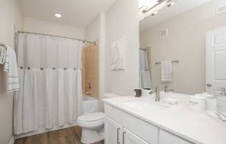 a bathroom with a shower and a toilet and a sink at Sladestone Shadow Creek, Pearland, TX, 77584