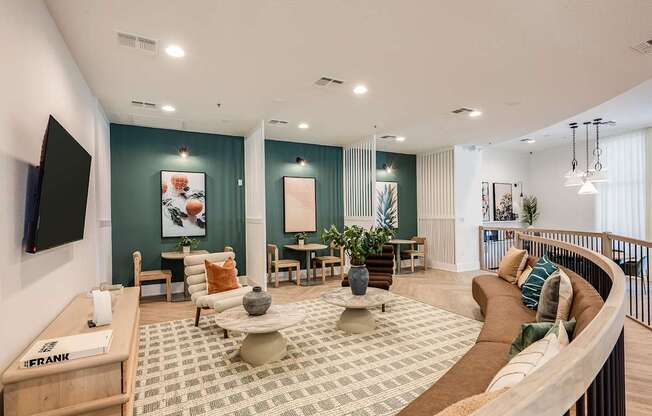A living room with a green wall and a white ceiling.