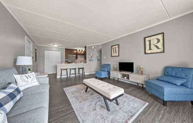 Renovated Living Room with frames at Woodland Ridge Apartments in Woodridge, IL